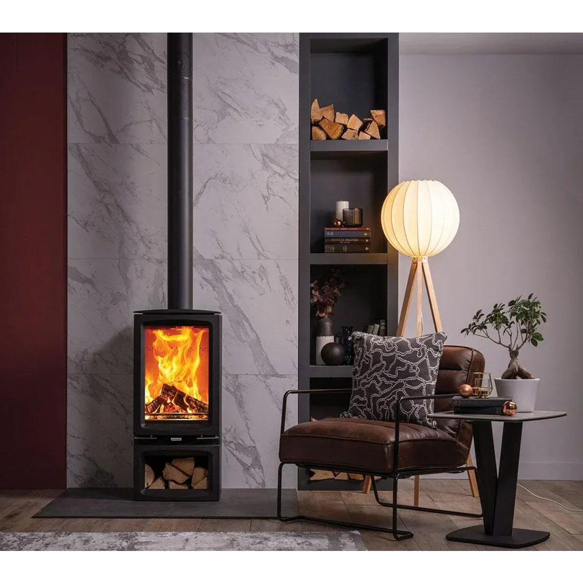 Modern living room with wood burner, brown accent chair, tripod floor lamp and side table