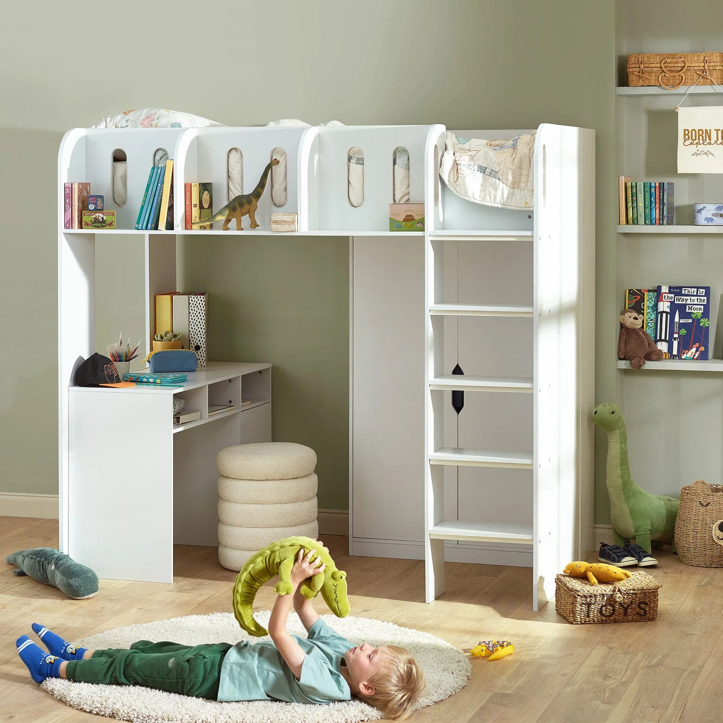 White kids loft bed with a built-in desk, ladder, and bookshelves in a modern bedroom