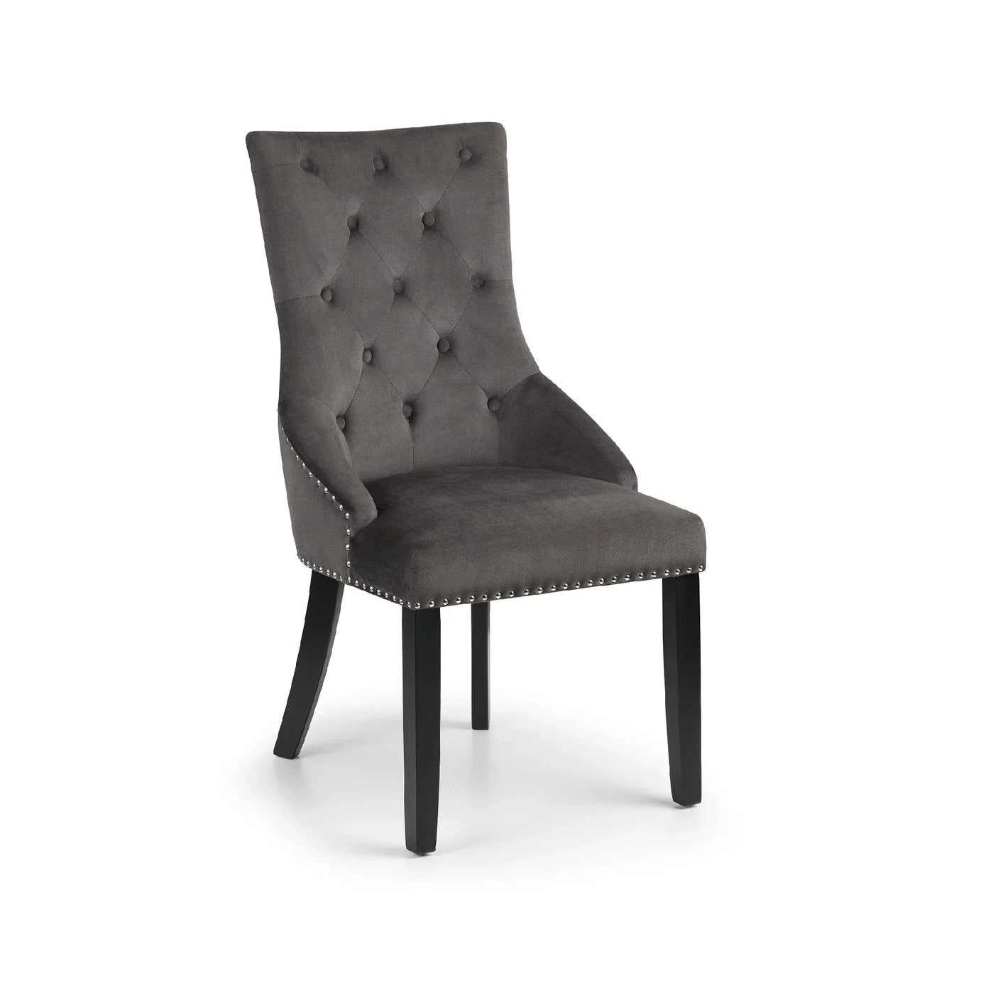 Velvet knockerback chair with button-tufted back and silver stud detailing on dark wooden legs