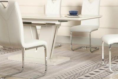 White extension dining table with modern base and matching chrome leg chairs