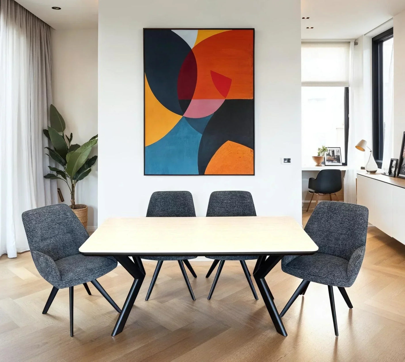 Rectangular dining table with light wood top and four grey upholstered chairs in modern room