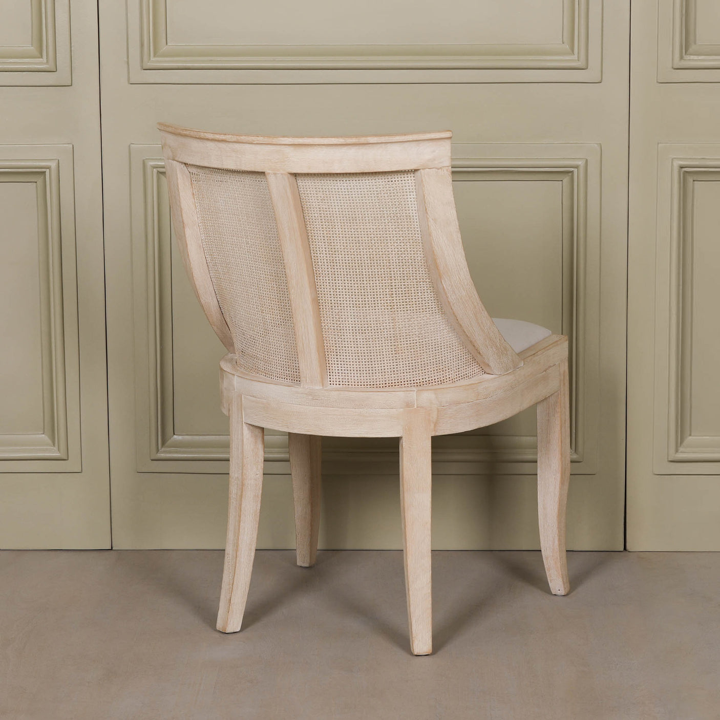 Light Wooden Sloped Rattan Upholstered Dining Chair with birch wood and linen in a natural finish
