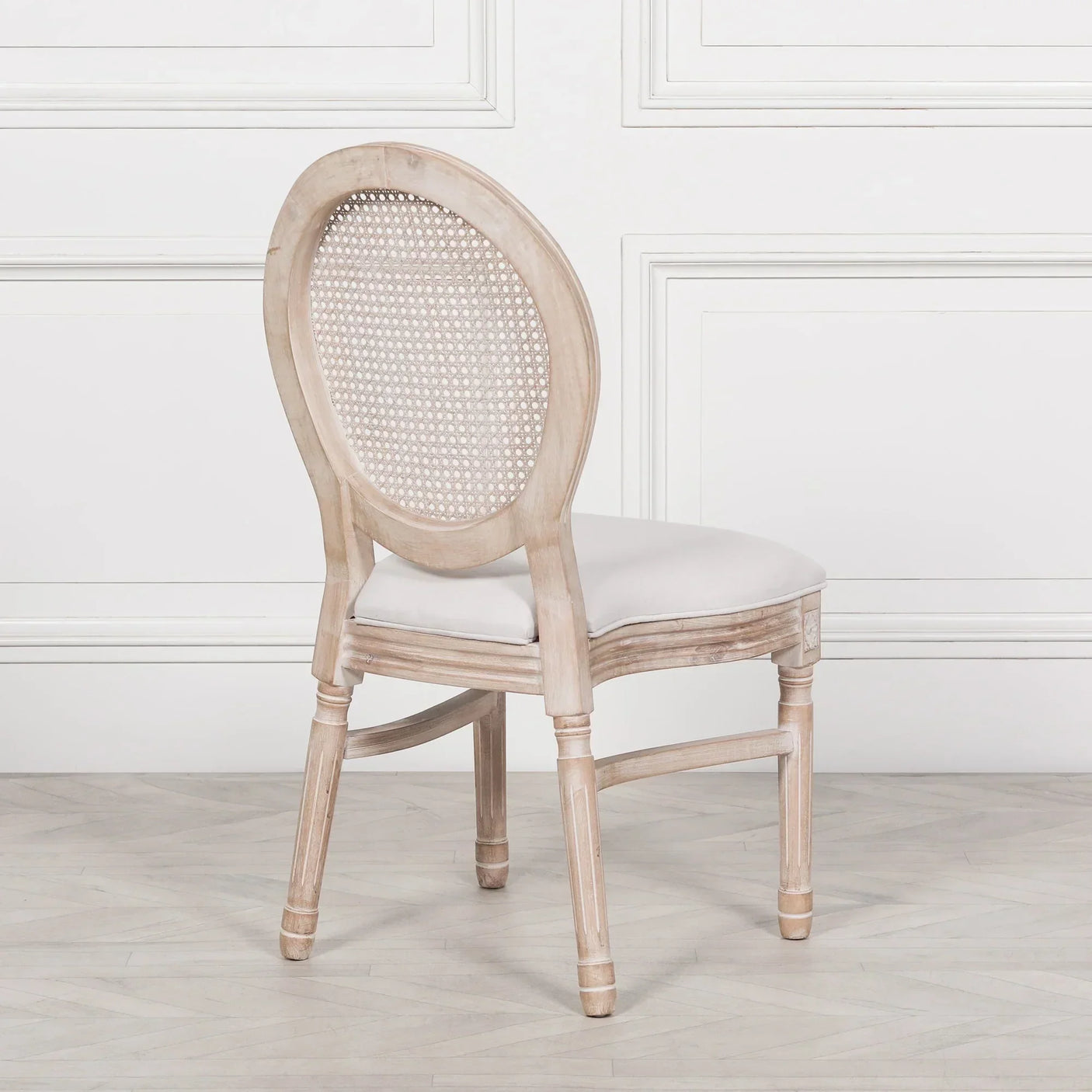 Oak dining chair with oval cane backrest and light upholstered seat in classic style