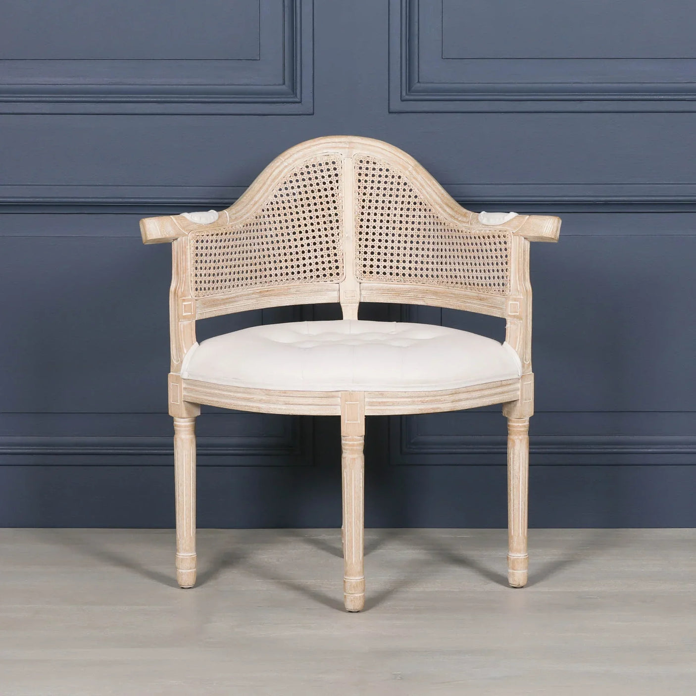 Natural wood occasional chair with cane backrest and cream upholstered seat