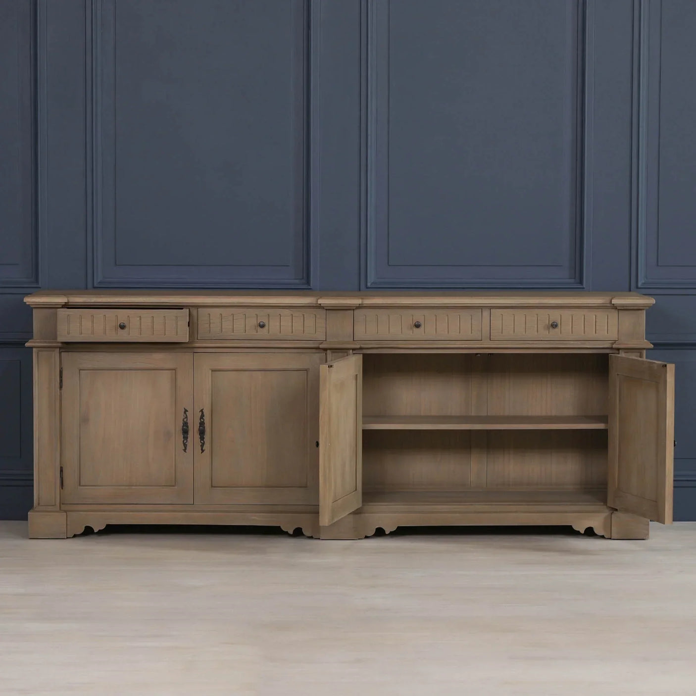 Wooden sideboard with four drawers and open double cabinet doors revealing one shelf inside