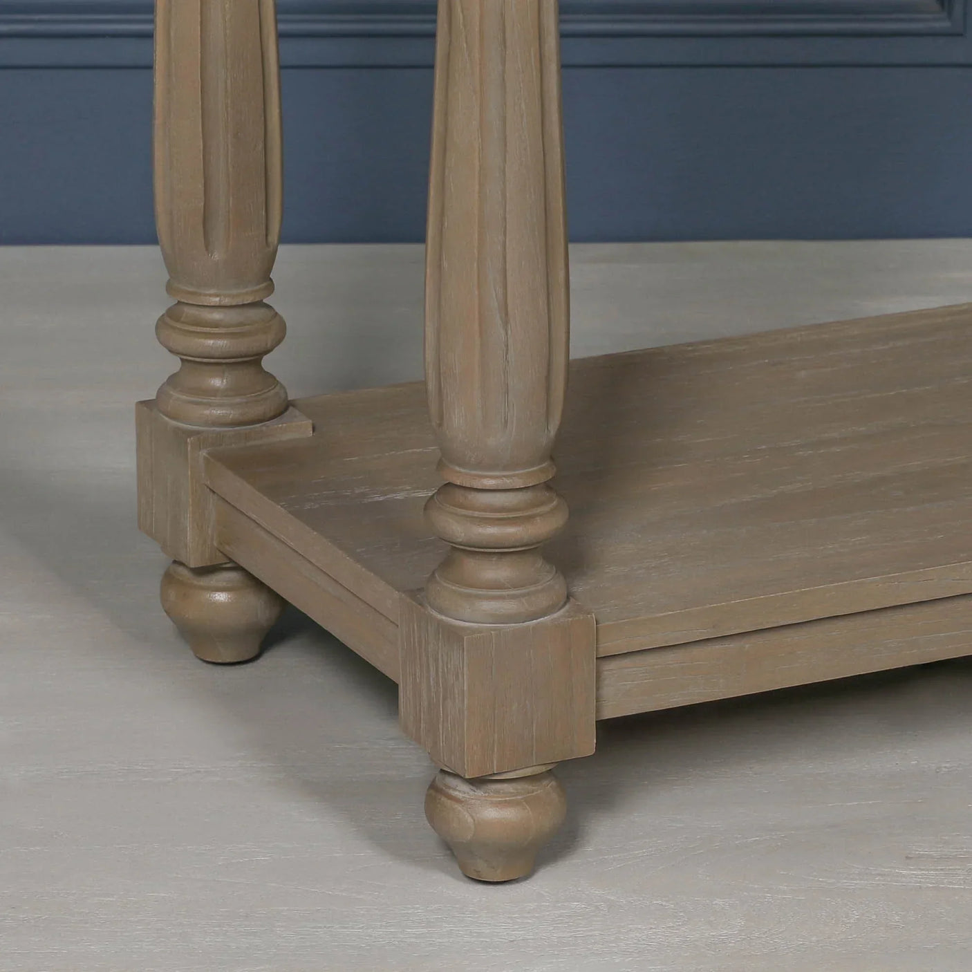 Light oak coffee table legs and lower shelf with turned wood detail