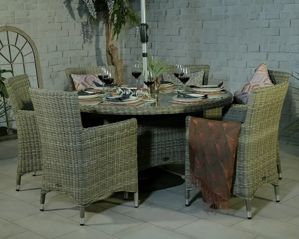 Round rattan dining set with six wicker chairs, set for dining, patio background