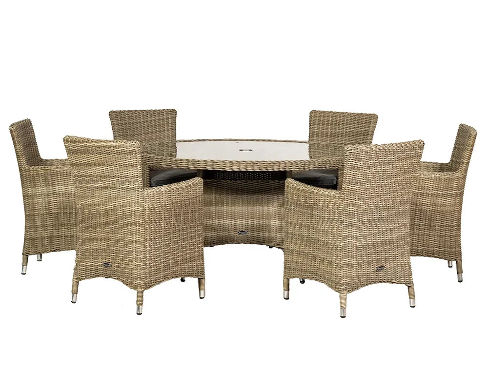 Rattan dining set with six wicker chairs and round glass-topped table, indoor or outdoor use