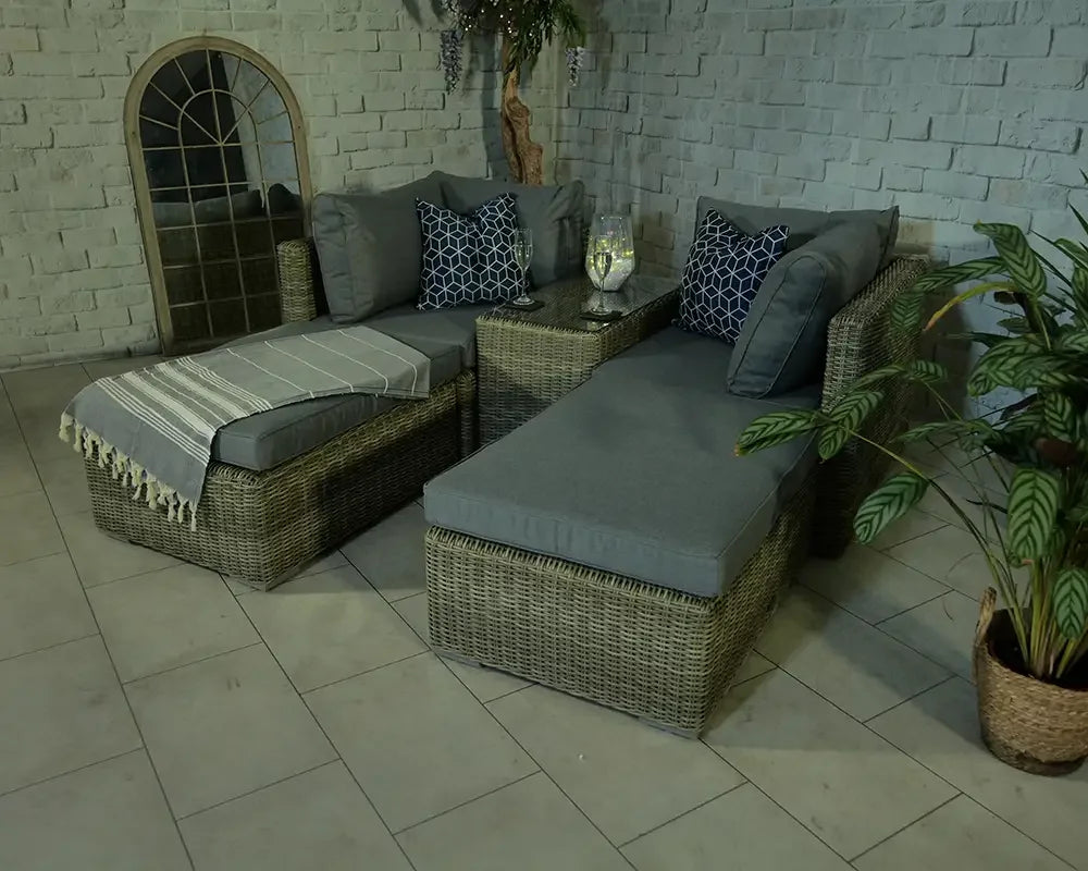 Rattan garden chaise lounge set with grey cushions, scatter pillows and side table
