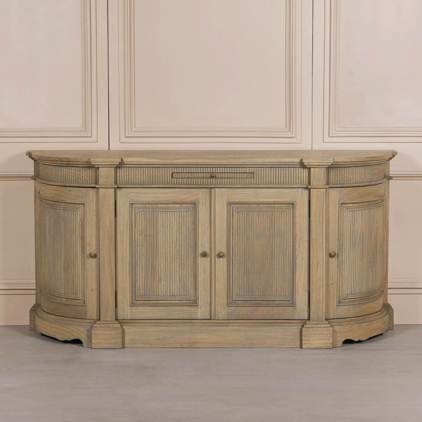 Rustic wooden buffet sideboard with fluted detailing and three doors.