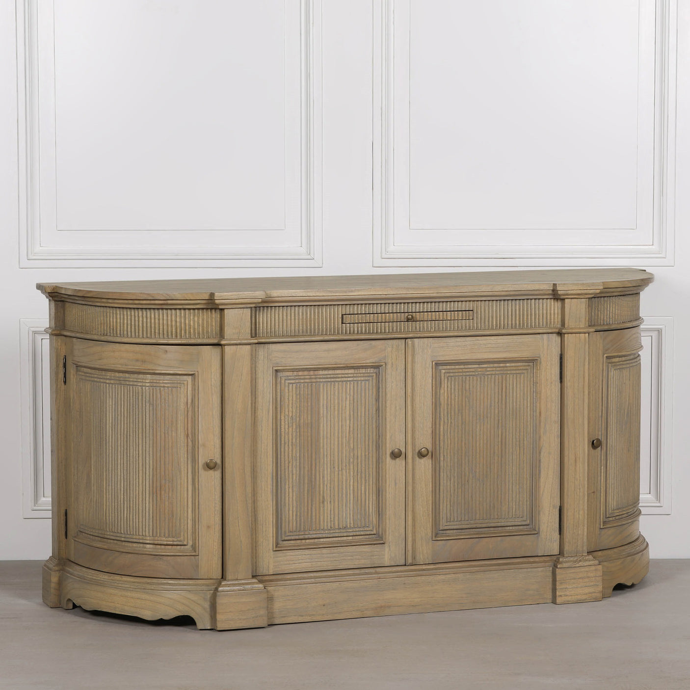 Rustic wooden buffet sideboard with fluted detailing and three cabinet doors.