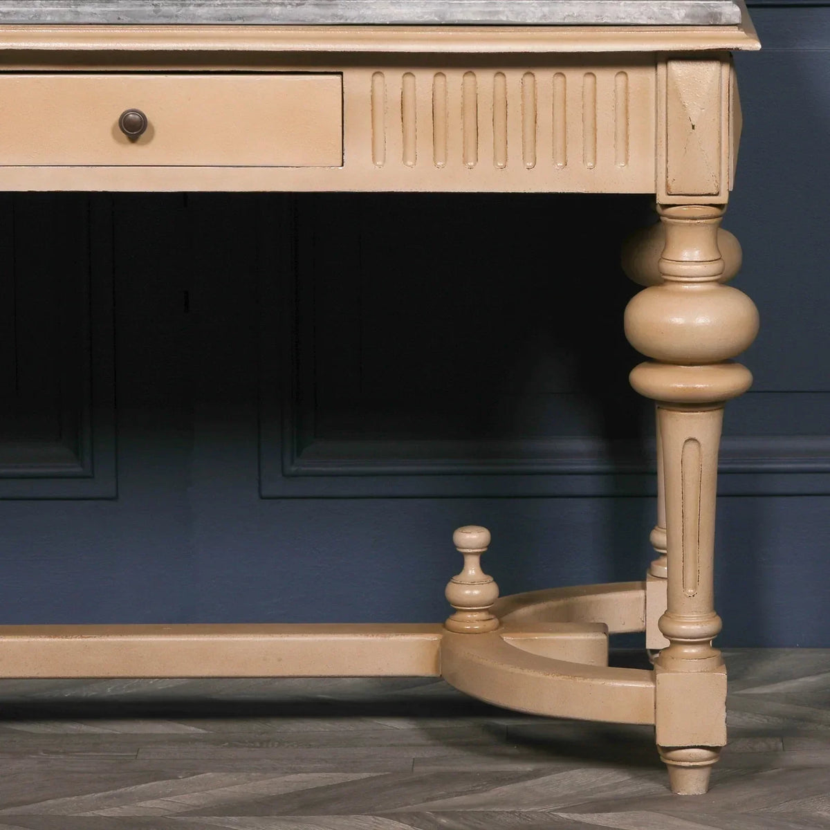 Wooden console table with turned legs and marble top, close-up of leg detail
