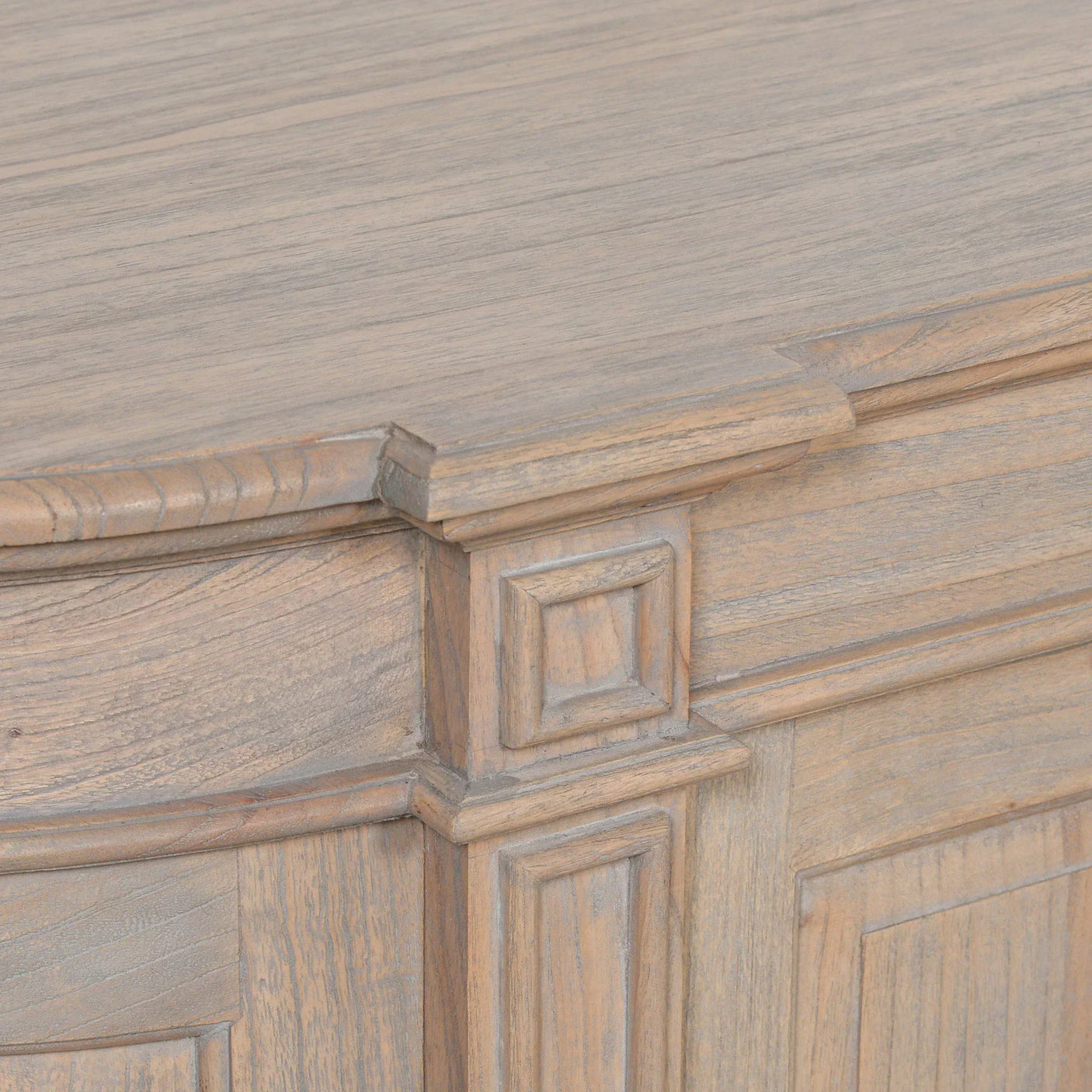 Oak sideboard closeup showing wood grain and carved corner detailing