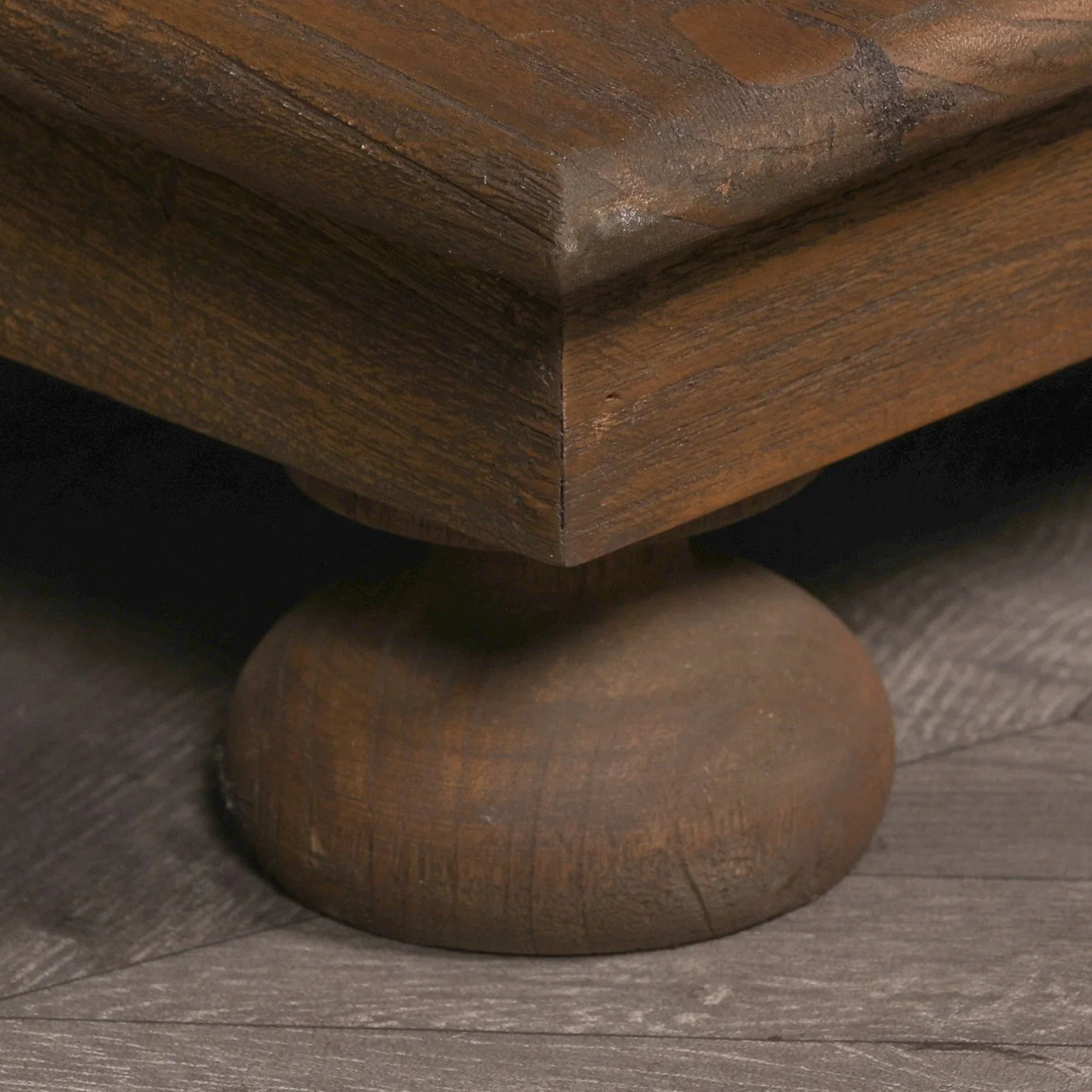 Solid wood coffee table corner with round turned leg and natural brown finish