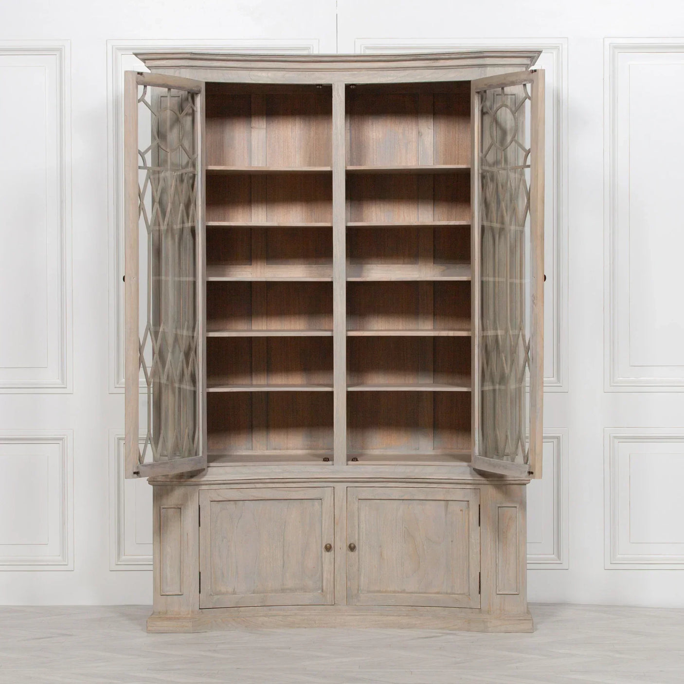 Corner display cabinet with open glass doors, wooden shelves, and lower storage cupboards