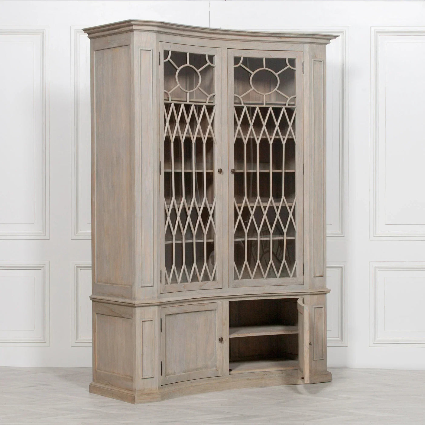 Tall wood display cabinet with glass lattice doors and lower storage compartments