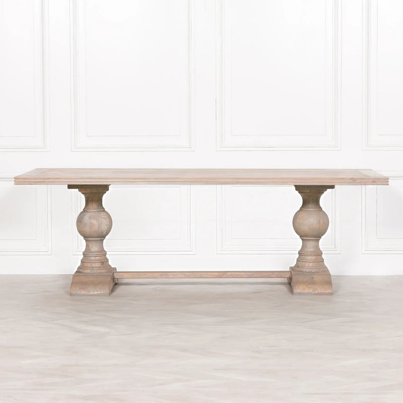 Solid wood dining table with double pedestal base and natural oak finish