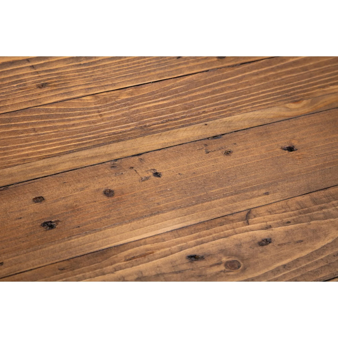 Close up of natural wood dining table surface with visible grain and rustic knots