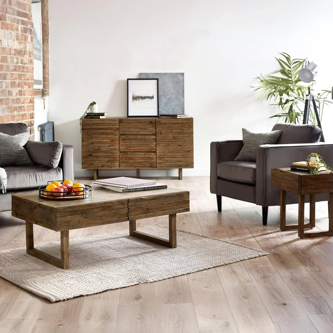 Rustic wooden coffee table set with matching sideboard and armchair in modern living room