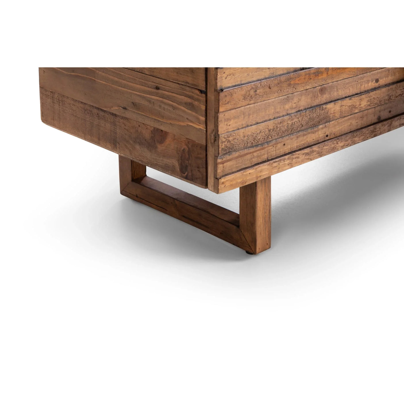Close view of wooden furniture leg and textured timber panel, natural finish