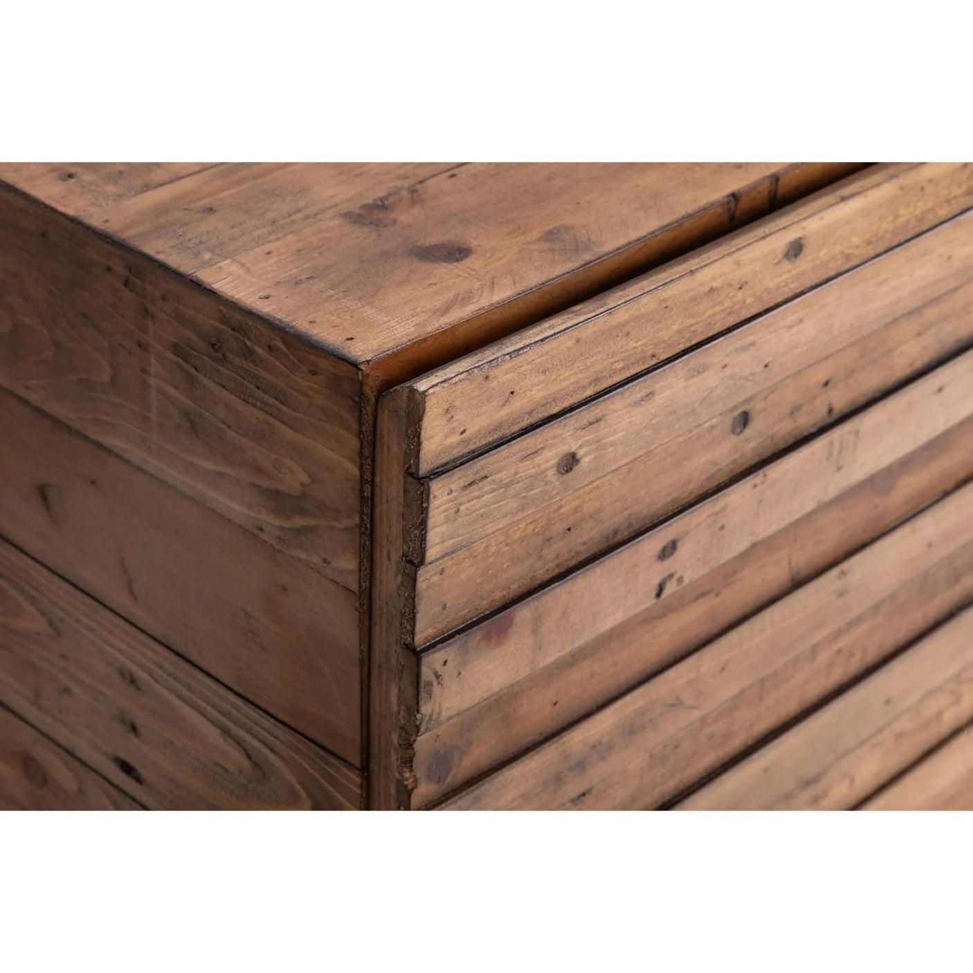 Rustic wooden chest of drawers close-up showing natural wood grain and horizontal slats