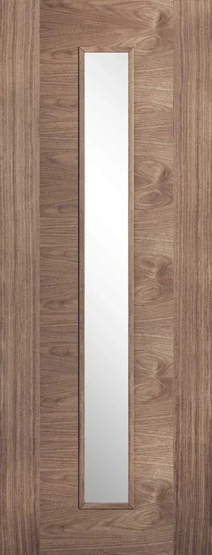 Walnut interior door with long vertical glazed panel and natural wood grain finish