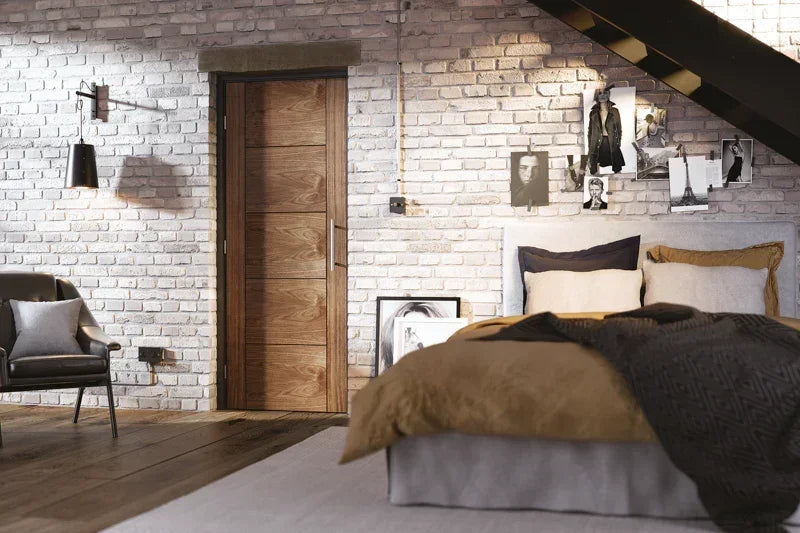 Walnut internal door with horizontal panels in a modern bedroom with white brick walls