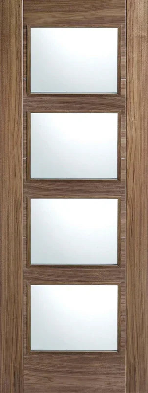 Walnut glazed internal door with four clear glass panels and natural wood grain finish