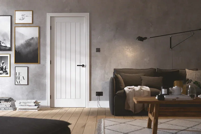 White Mexicano internal door with vertical grooves in modern living room setting