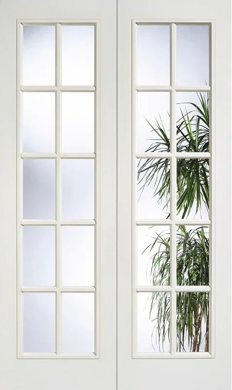 White moulded glazed door pair with clear glass panels and indoor plant reflection