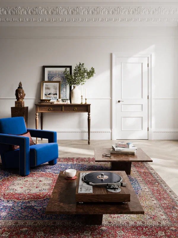 White Toledo coffee table with vinyl player on patterned rug in stylish living room
