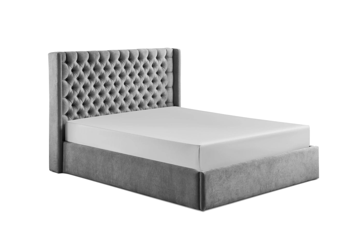 Grey upholstered bed frame with deep buttoned headboard, side angle view