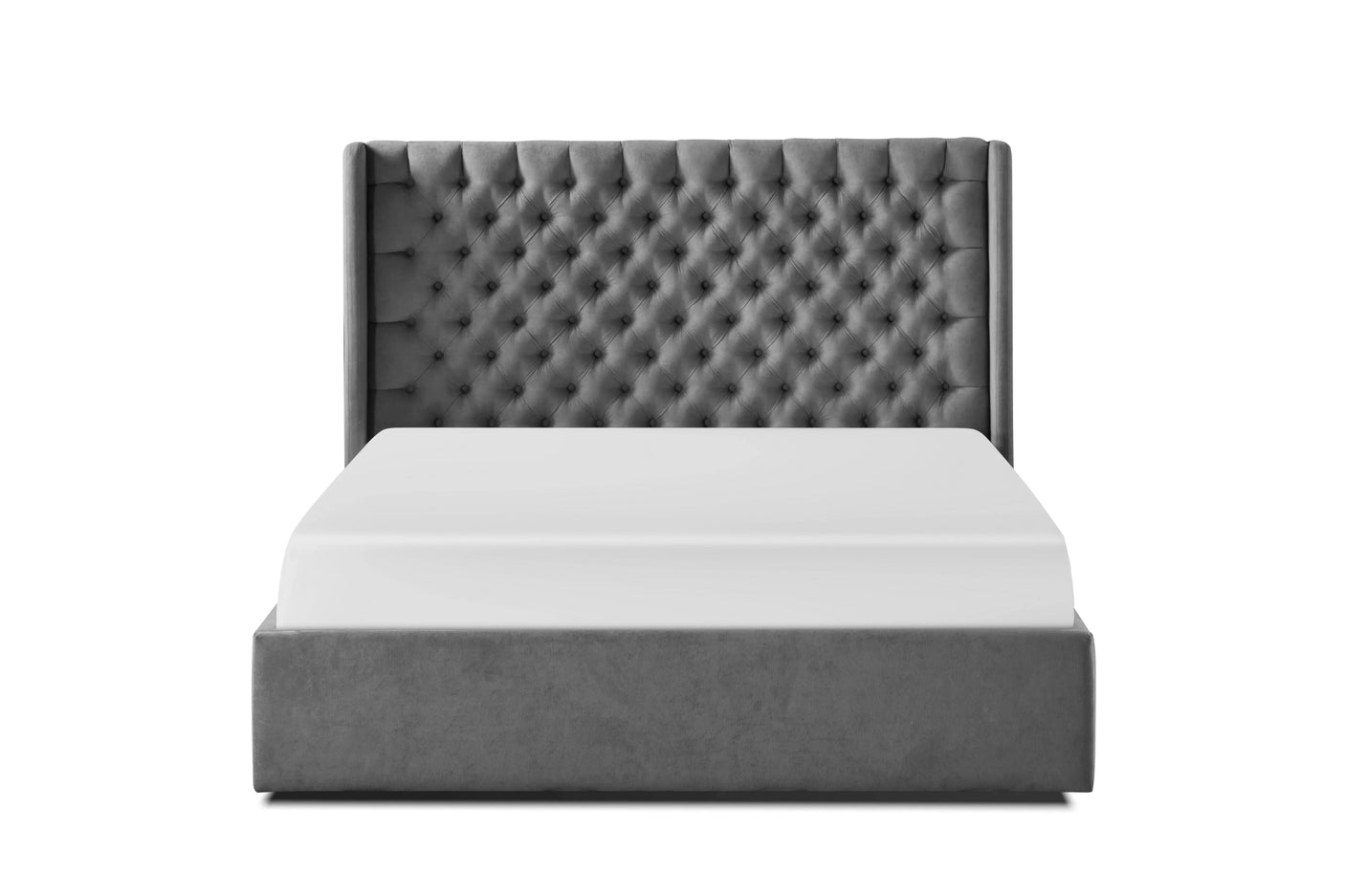 Grey upholstered bed with tall, button-tufted headboard and low base, front view