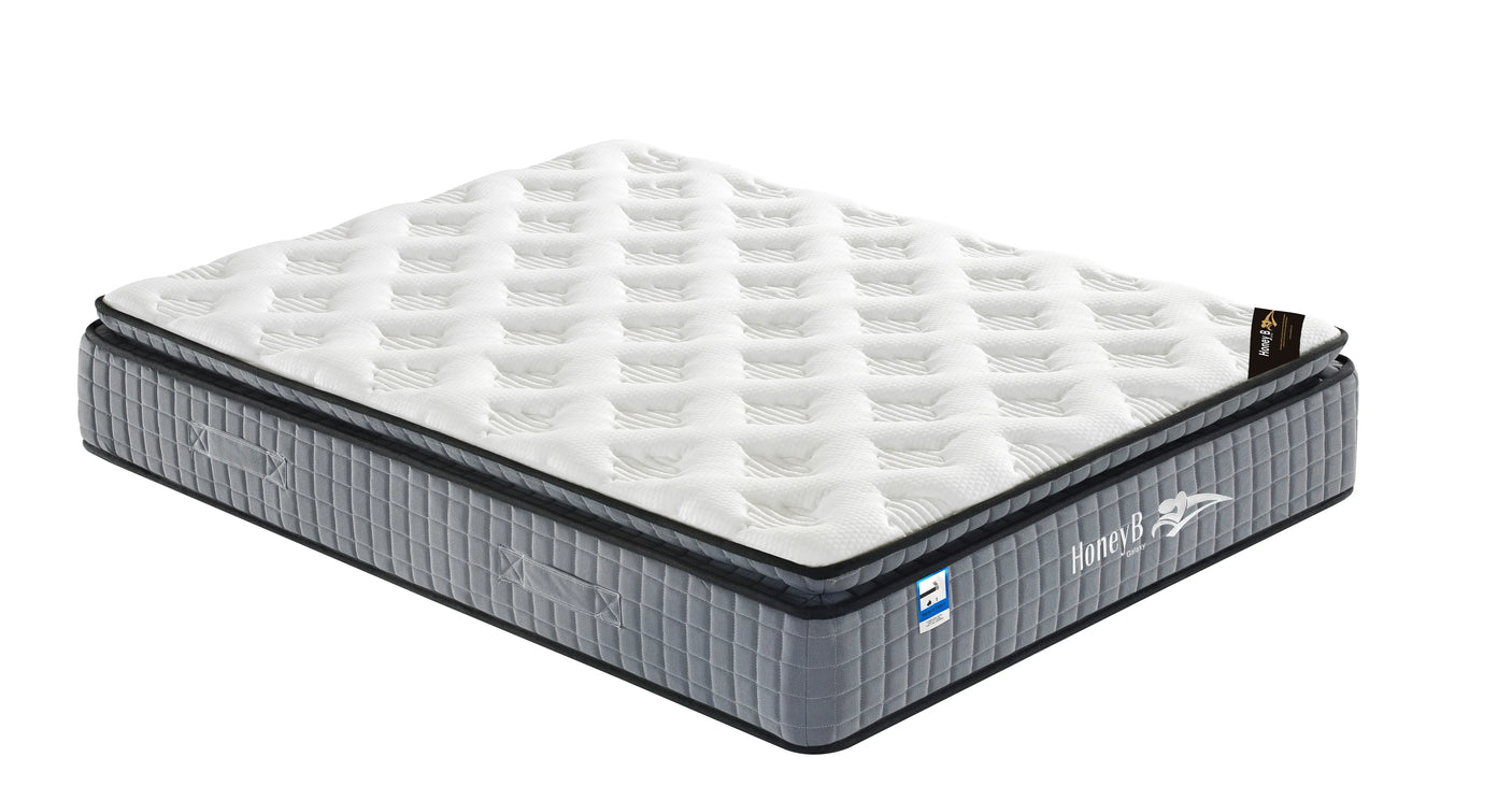 Double mattress with white quilted top and grey fabric sides, corner angle view