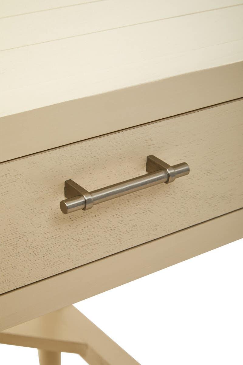 Light wood drawer table with metal handle and panel detailing, close-up view
