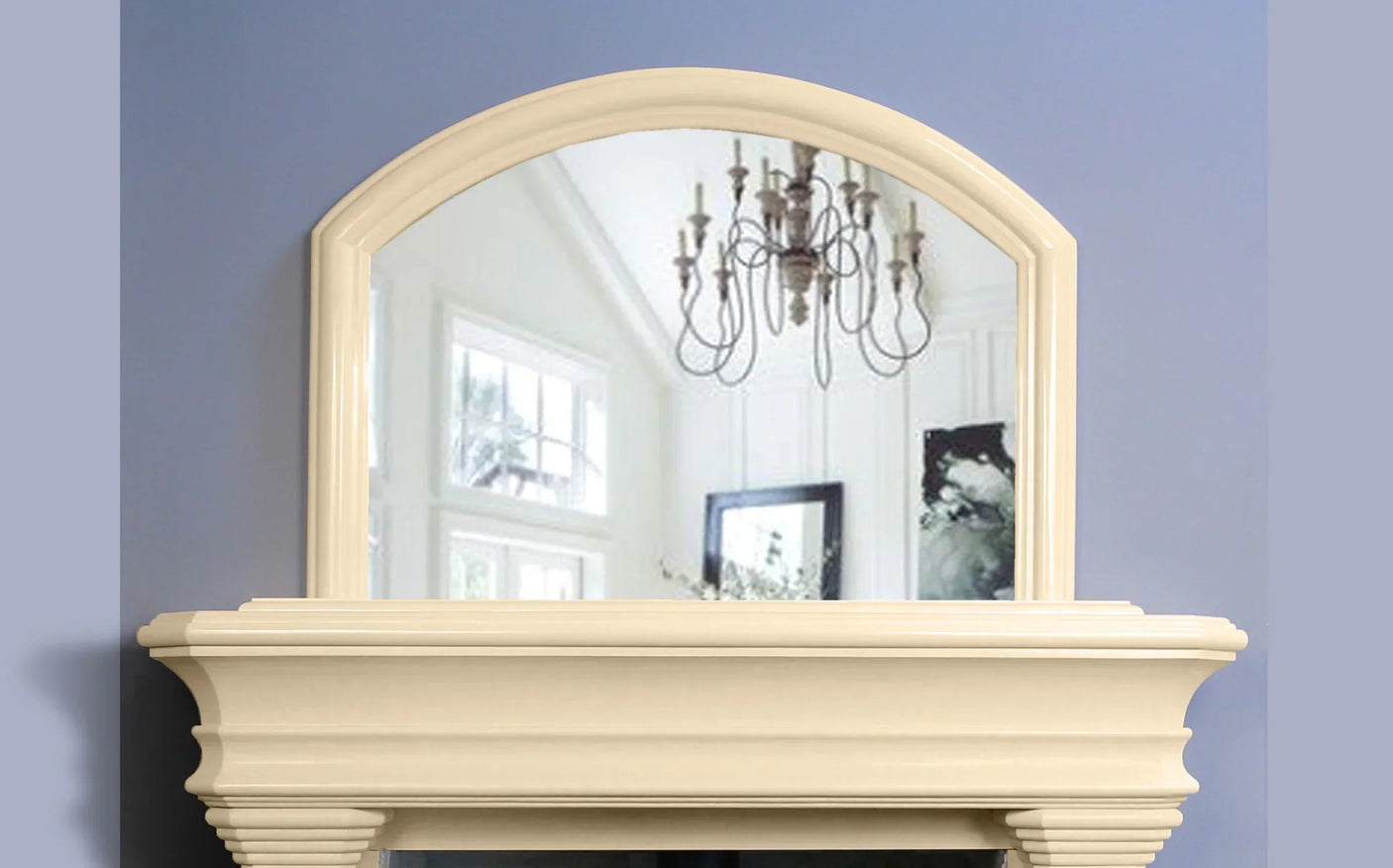 arched overmantle mirror with ivory cream wood frame on wall