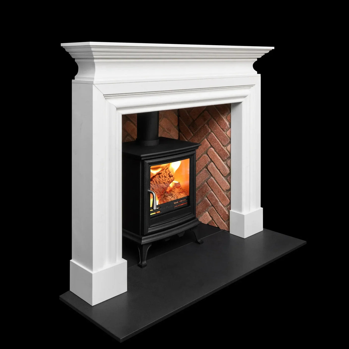 White fireplace surround with brick interior and black wood burning stove on black hearth