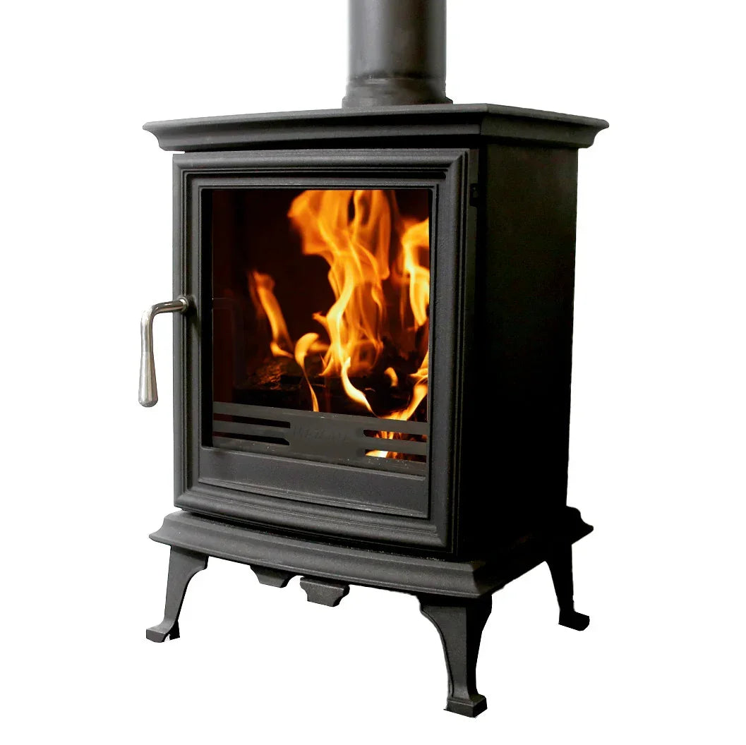 Black cast iron wood burning stove with visible flames through glass door