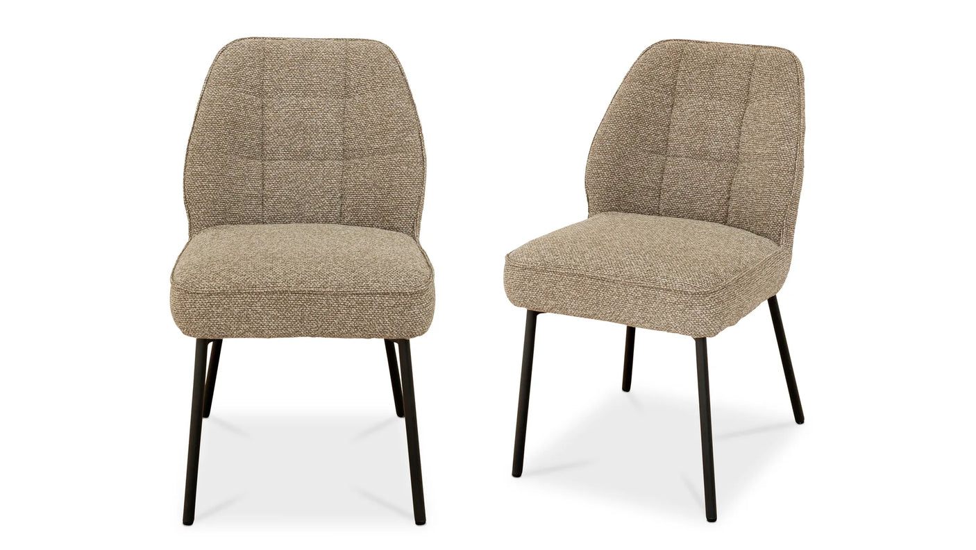 Two beige upholstered chairs with black legs on a white background