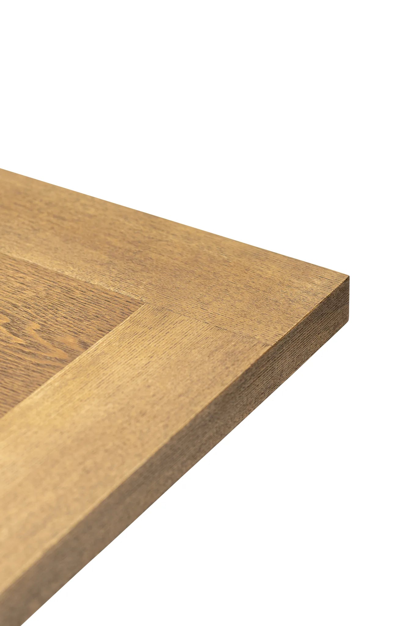 Close-up of a wooden surface with a visible grain pattern on a white background