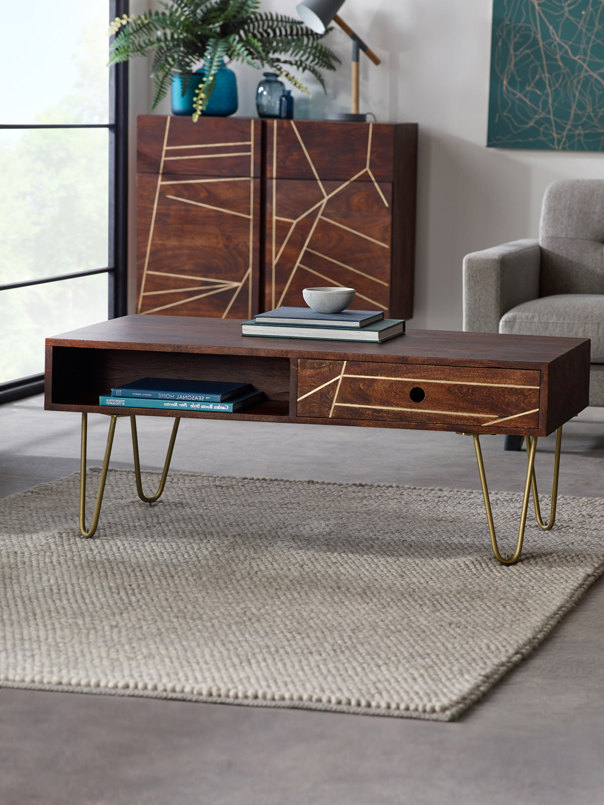 Modern dark gold rectangular coffee table with drawer, solid mango wood and metal inlays