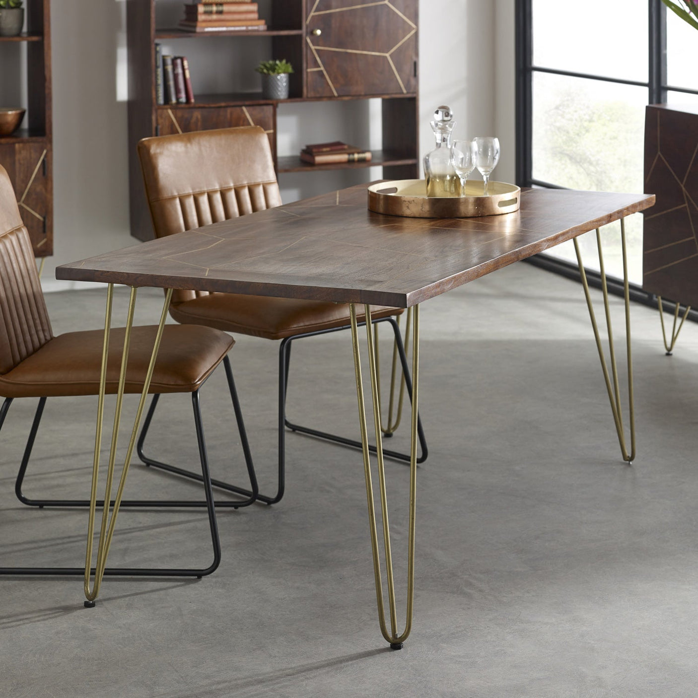 Dark gold dining table made of solid mango wood with metal inlays
