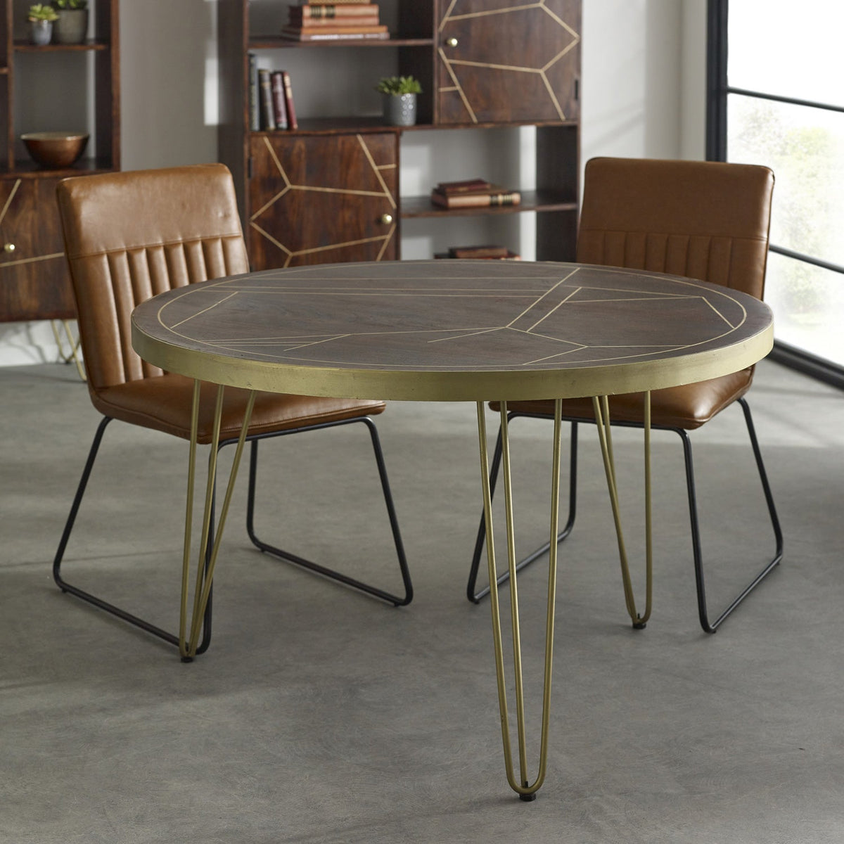 Dark gold round dining table made of solid mango wood with metal inlays