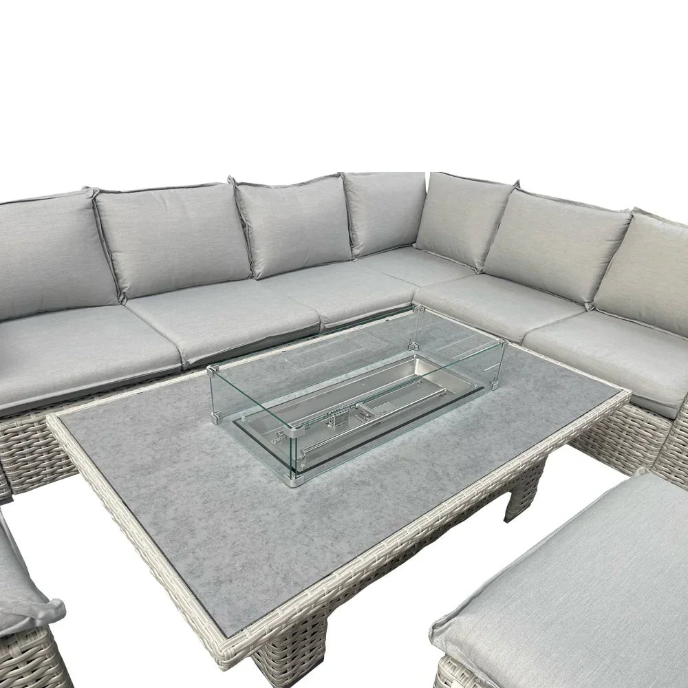 Grey rattan garden corner sofa set with cushions and glass fire pit table
