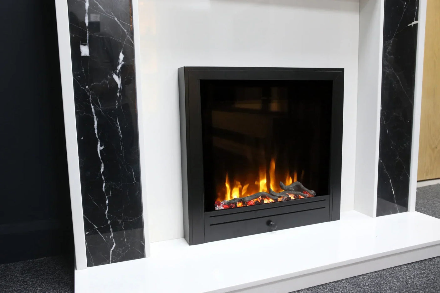 Electric fireplace with black marble sides and white mantel, lifelike flame effect
