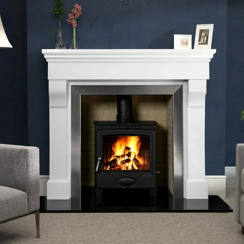 Polished polar white fireplace surround with wood burning stove in modern living room