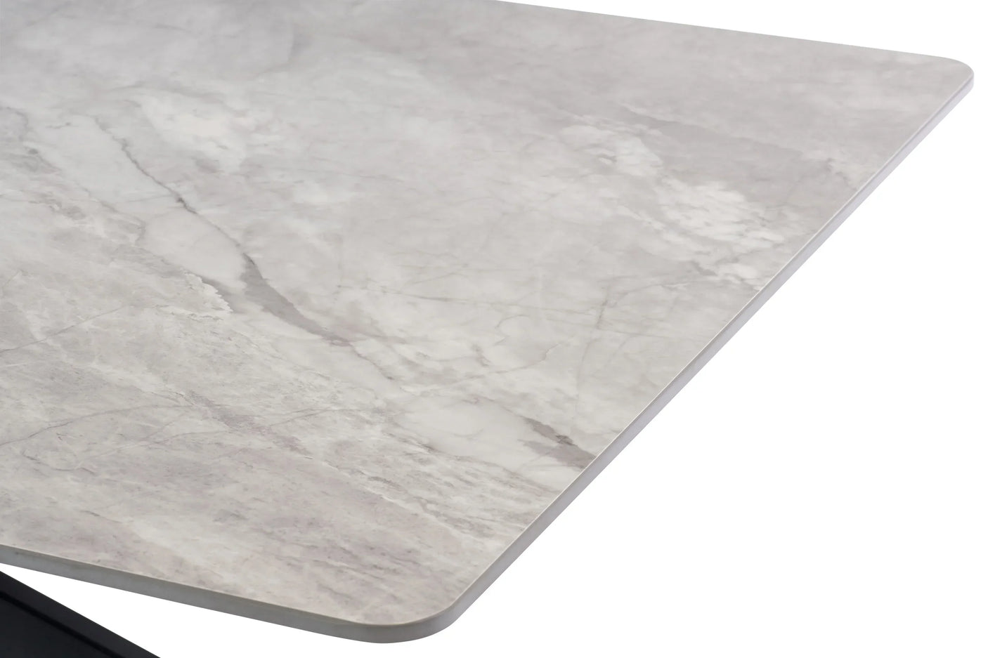 Close up of grey marble effect dining table corner with smooth rounded edge
