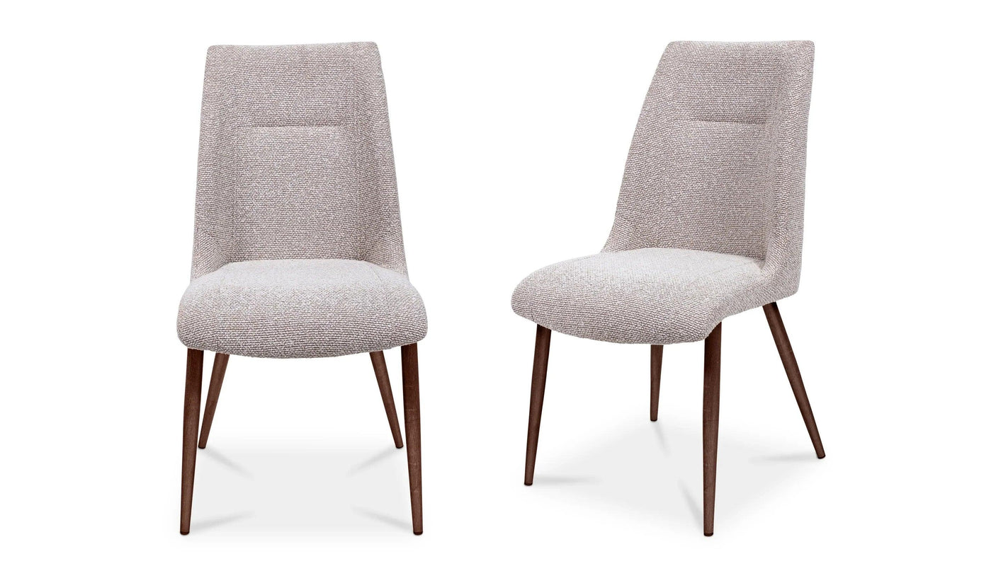 Pair of beige fabric dining chairs with angled wooden legs, front and side view