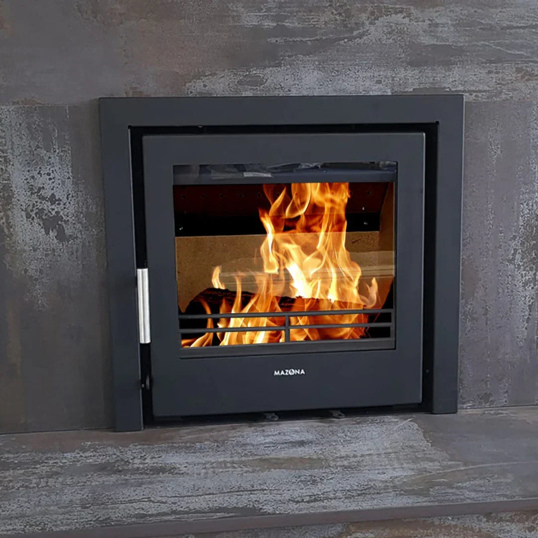close up steel multi fuel stove with glass door showing flames