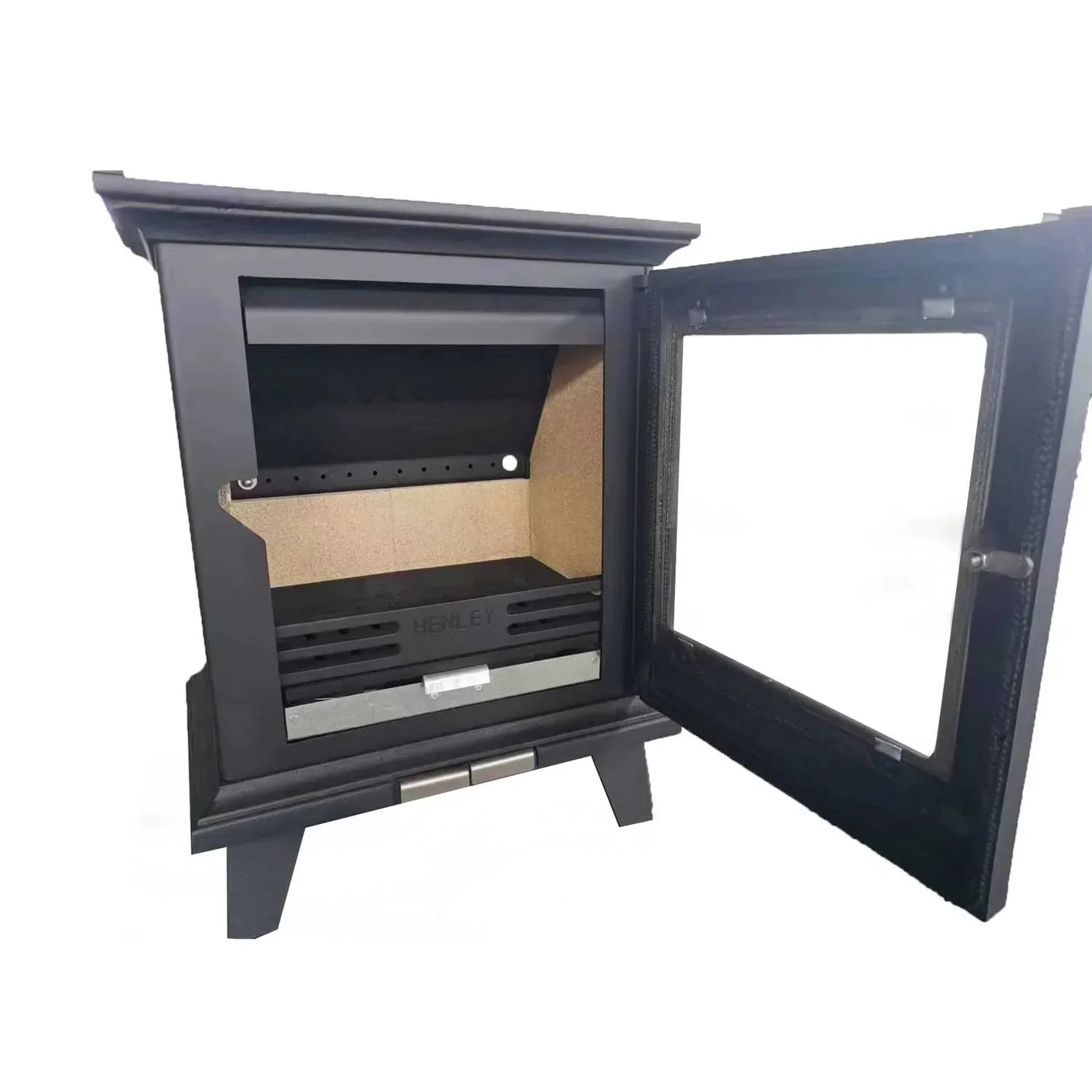 Black cast iron stove interior with open glass door and visible firebox compartment